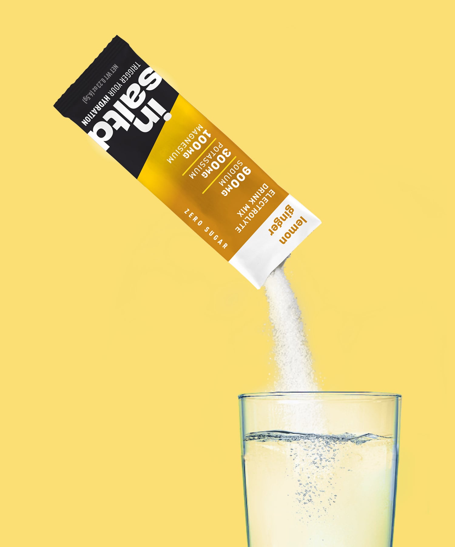 Insaltd Lemon Ginger hydration drink mix pouring into glass of water.
